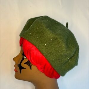 Green beret with silver studs.
